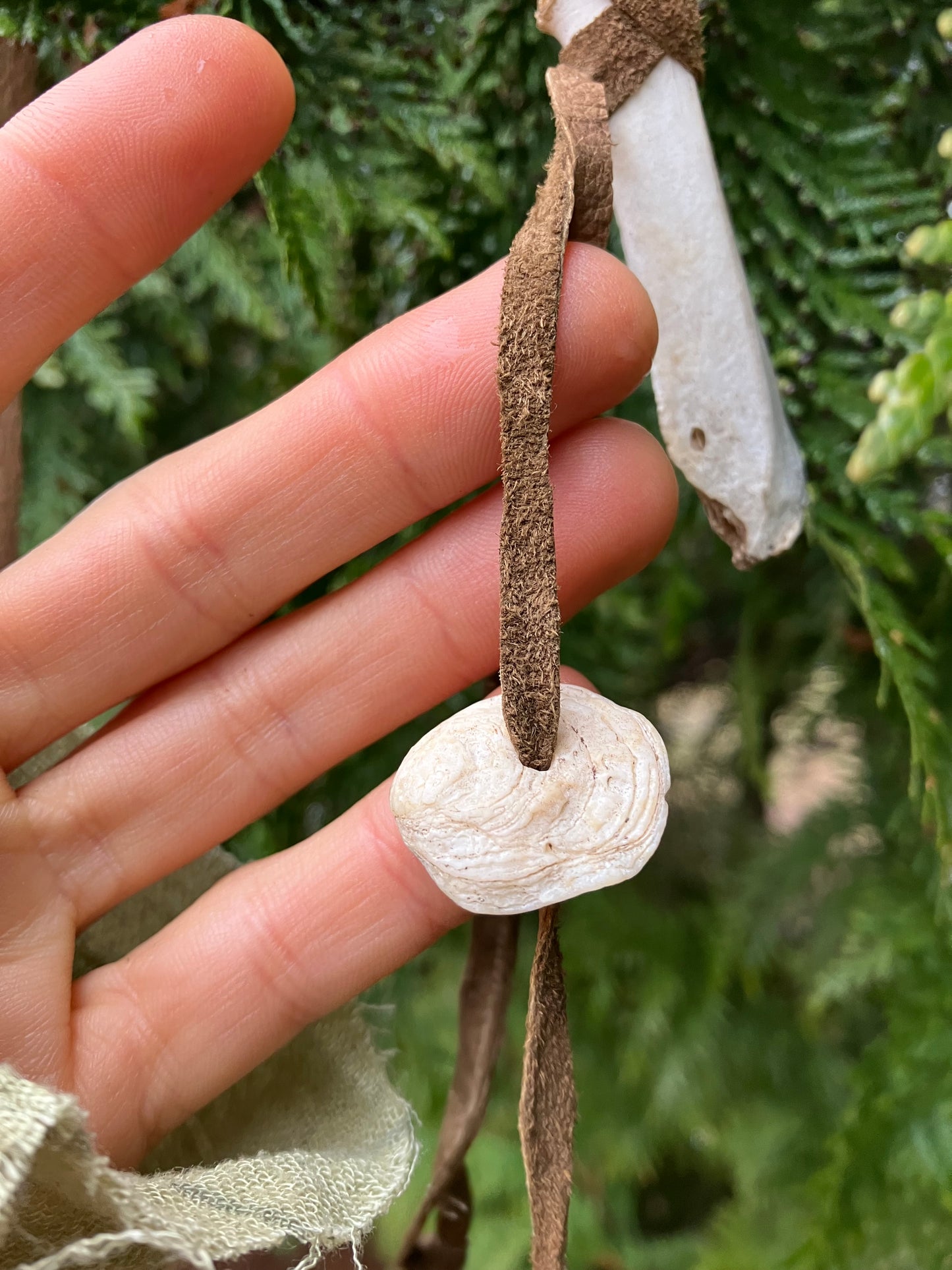 wildcrafted bone , feather & shell leather accessory piece