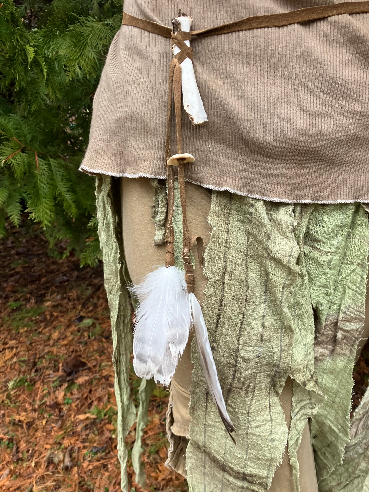 wildcrafted bone , feather & shell leather accessory piece